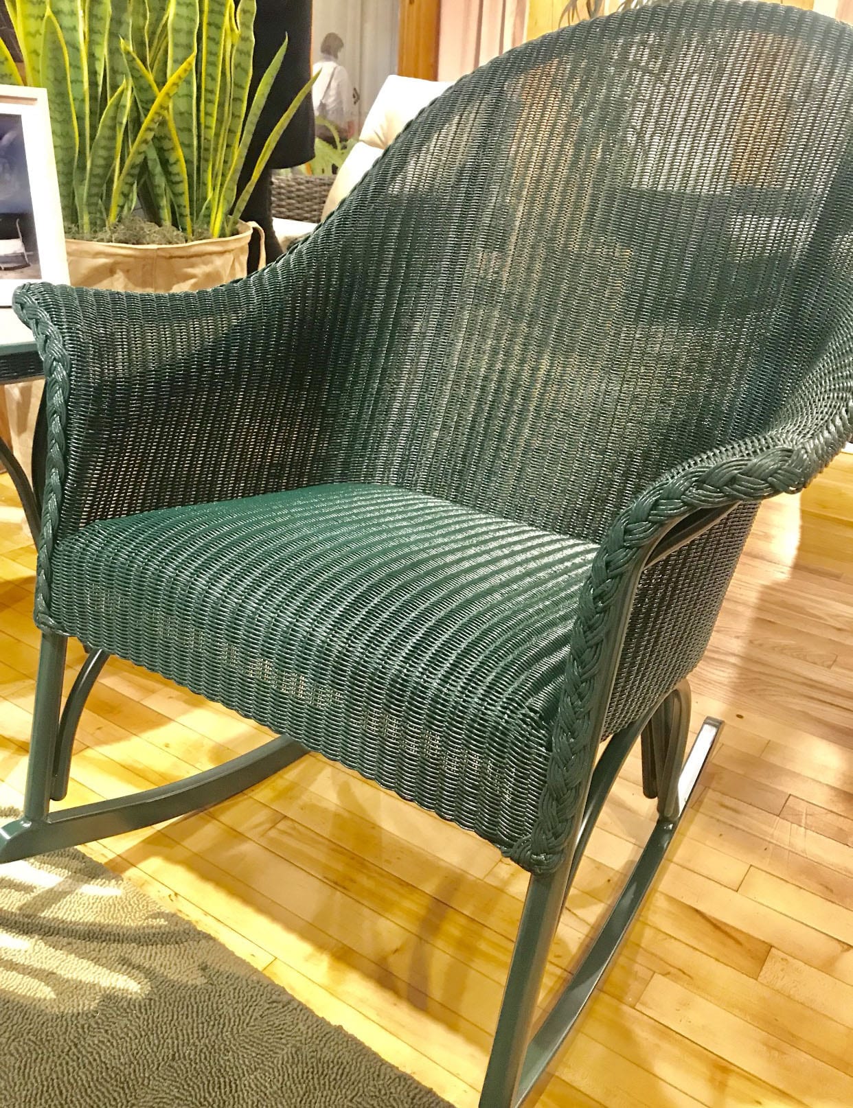 Green rattan rocking chair by Lloyd Flanders