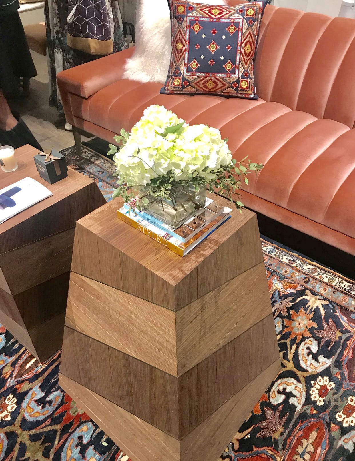 Rawan Issac display at High Point Market with modern two toned wooden table