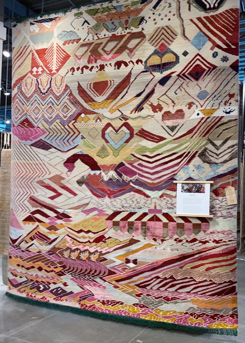 custom Jaipur rug Manchaha program hanging in showroom at high point market